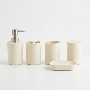 Cream-coloured plastic bathroom accessory set